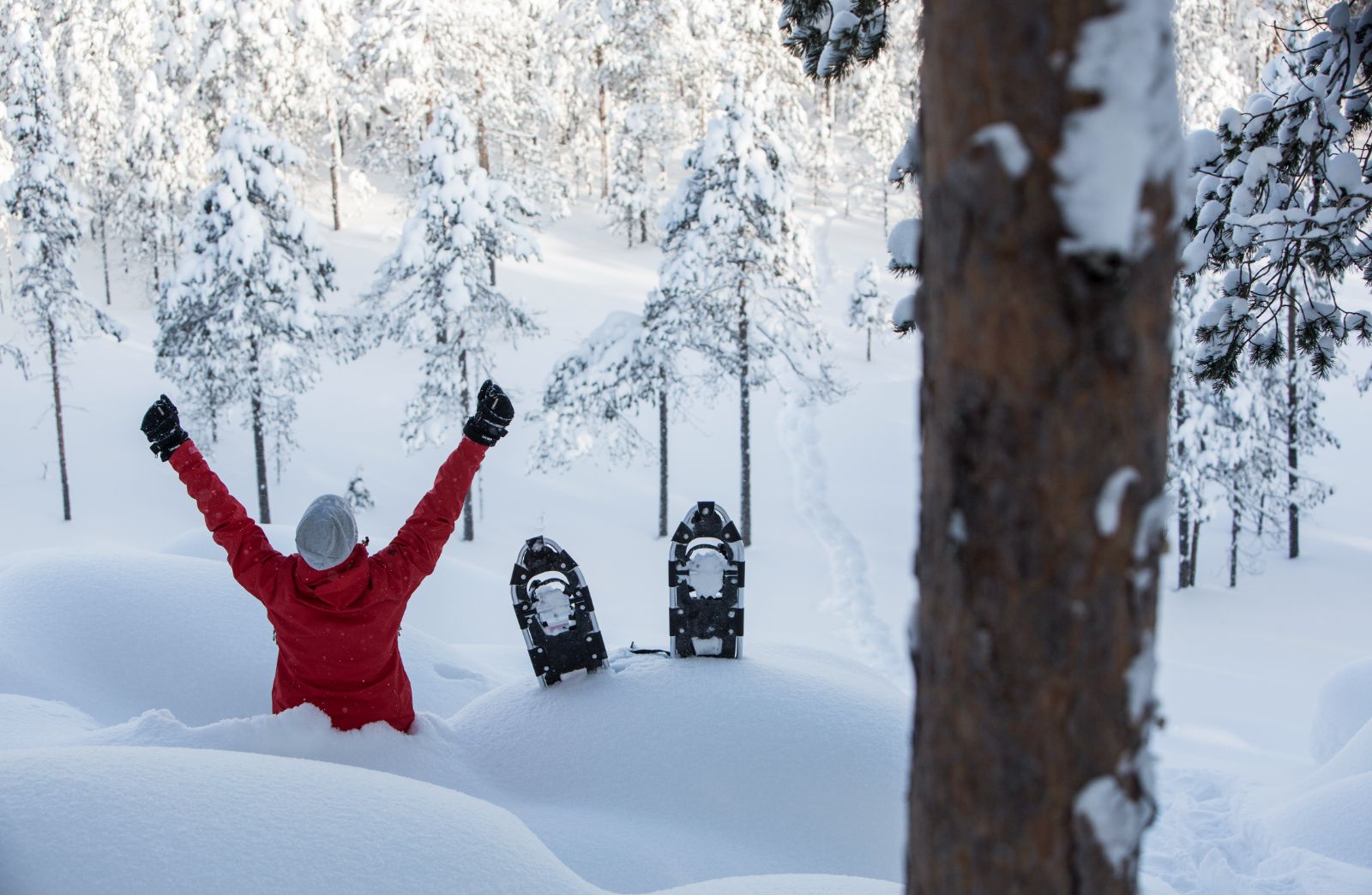 Guest snowshoeing during at stay at Aurora Safari Camp in Sweden