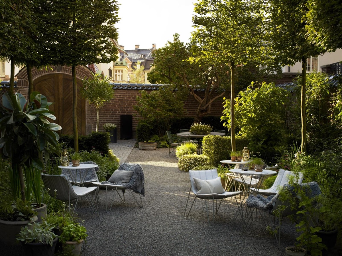Garden of Ett Hem, with comfortable chairs set aorund small tables