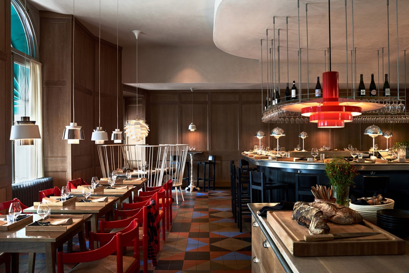Modern restaurant with seating at tables and at the bar