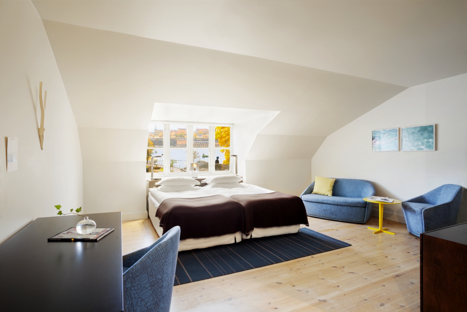 Spacious Deluxe room with desk and sitting area at Hotel Skeppsholmen