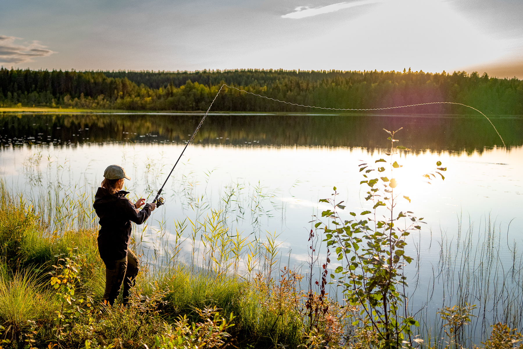 Fishing on the lake at Logger''s Lodge in Swedish Lapland