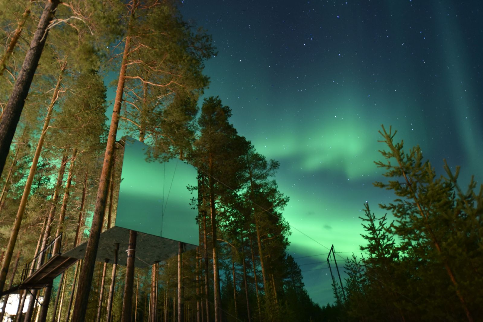 Mirror cube and Northern Lights at the Treehotel in Sweden