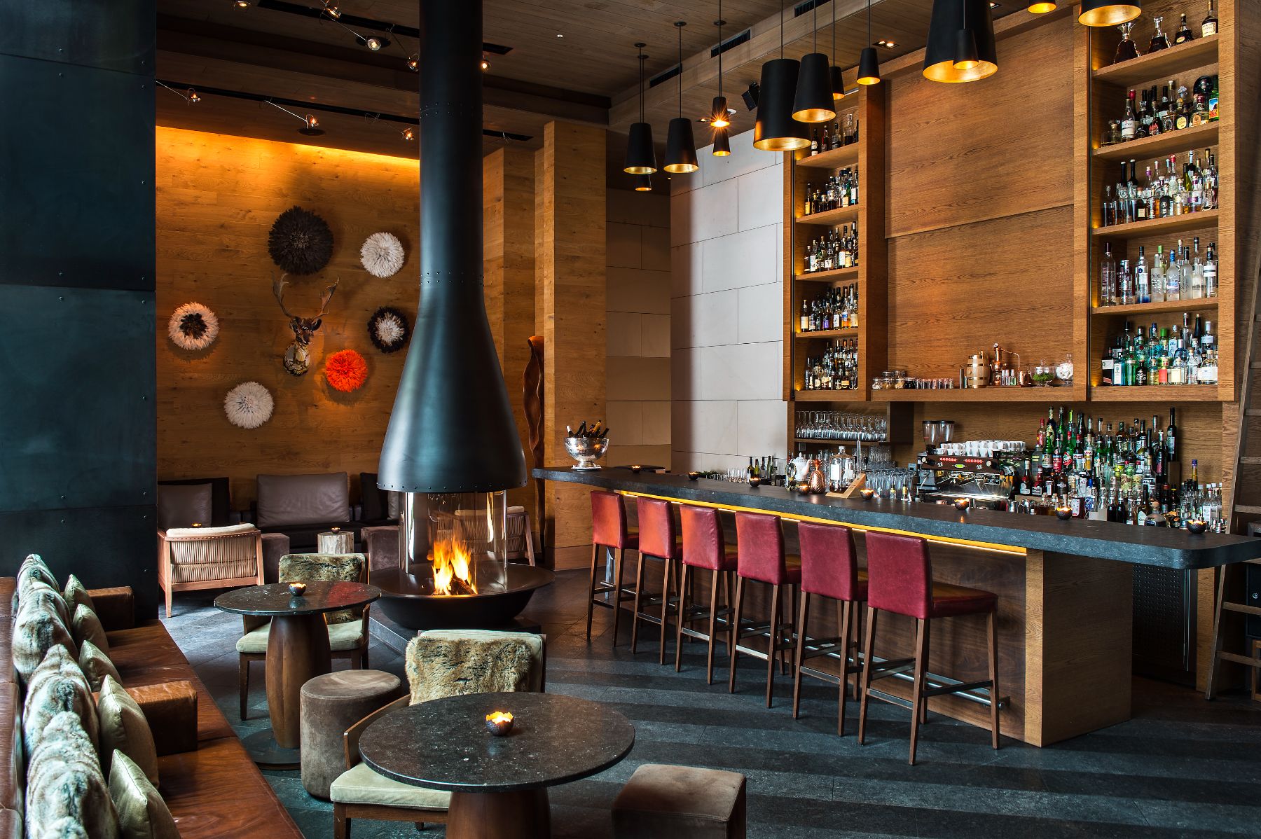 Cosy bar with fireplace at Chedi Andermatt Switzerland