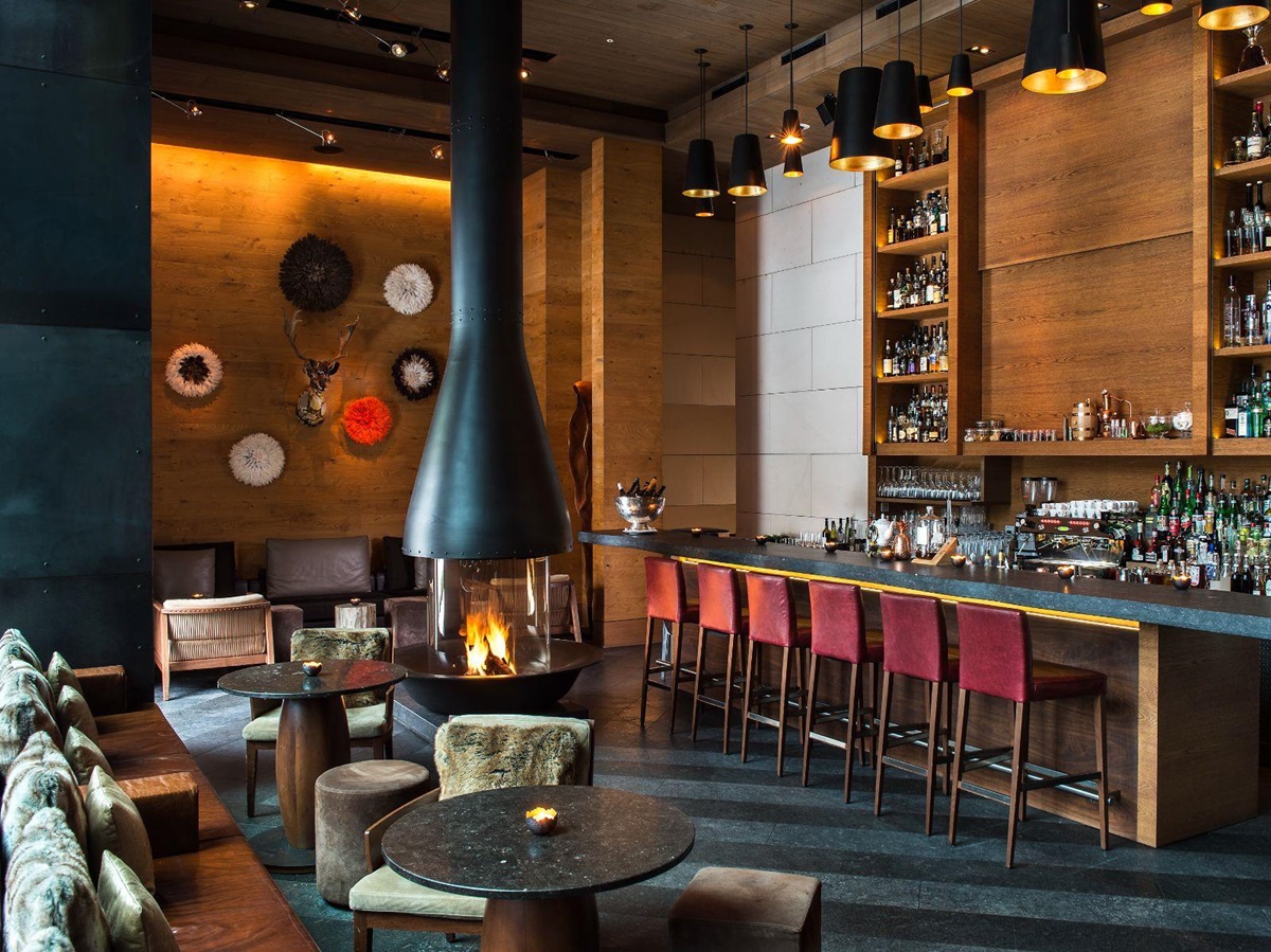 Cosy bar with fireplace at Chedi Andermatt Switzerland