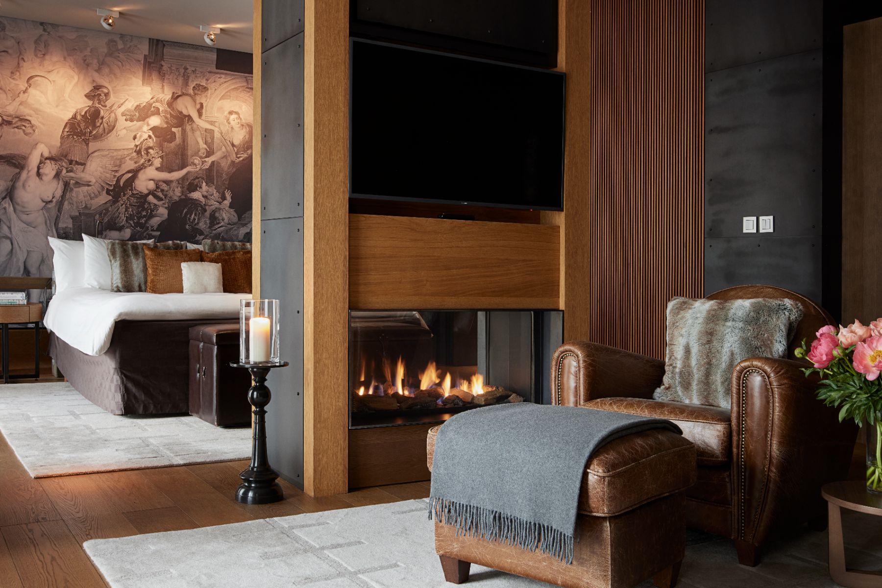 Living area and fireplace in a Deluxe Suite at Chedi Andermatt Switzerland