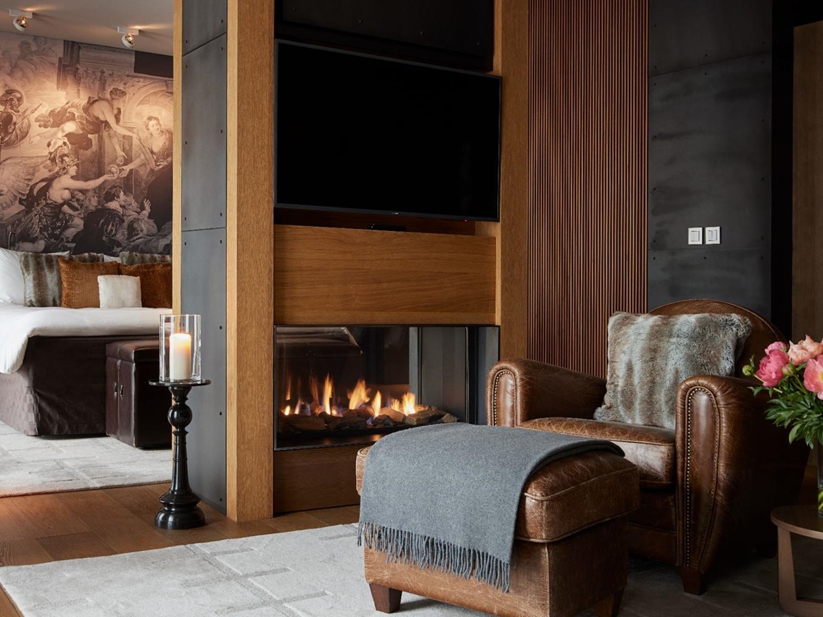 Living area and fireplace in a Deluxe Suite at Chedi Andermatt Switzerland