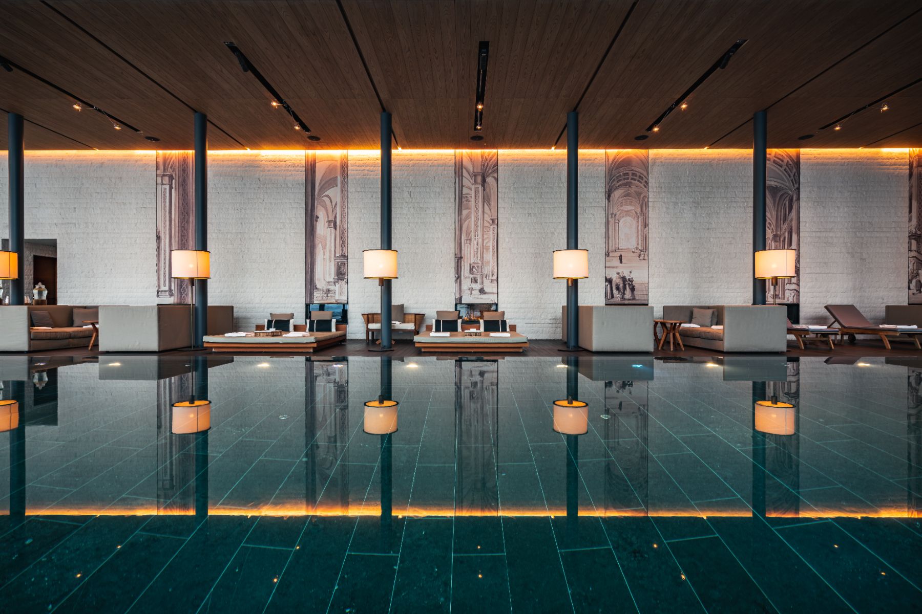 Indoor swimming pool and day beds at Chedi Andermatt Switzerland