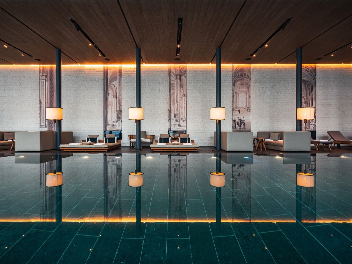 Indoor swimming pool and day beds at Chedi Andermatt Switzerland