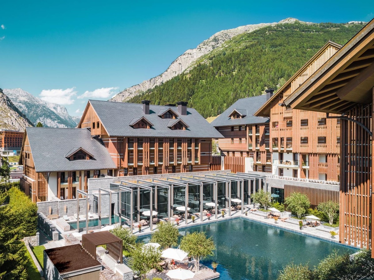 The outdoor swimming pool and terrace at Chedi Andermatt Switzerland
