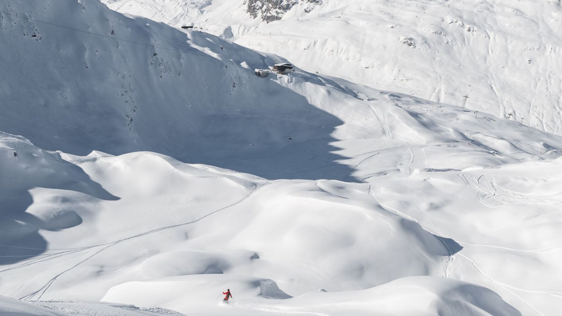 Skiers on the slopes near Chedi Andermatt Switzerland