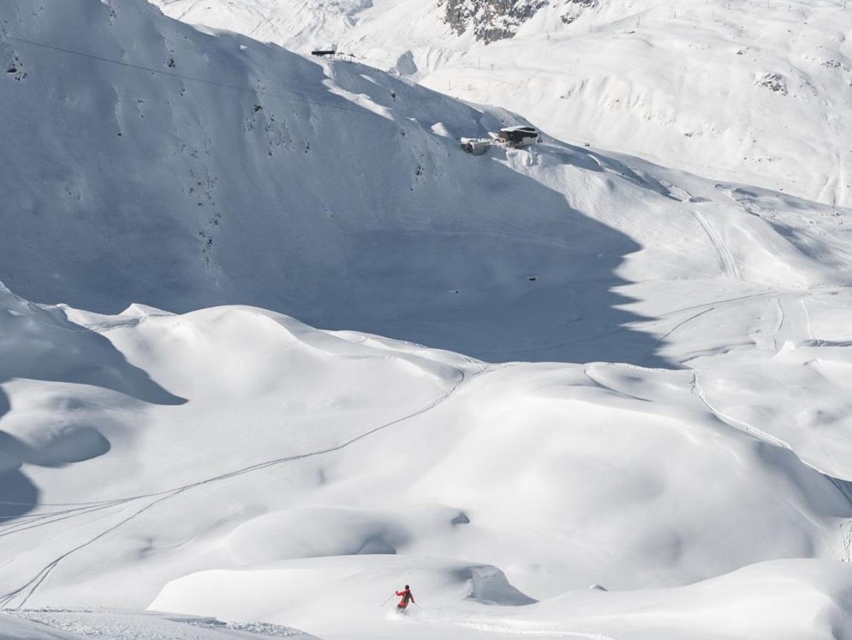 Skiers on the slopes near Chedi Andermatt Switzerland
