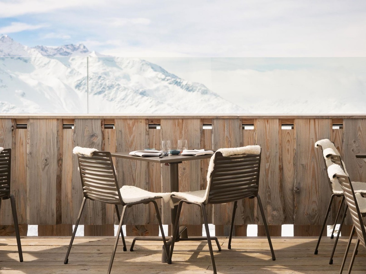View of snowy mountains from a terrace at Chedi Andermatt Switzerland
