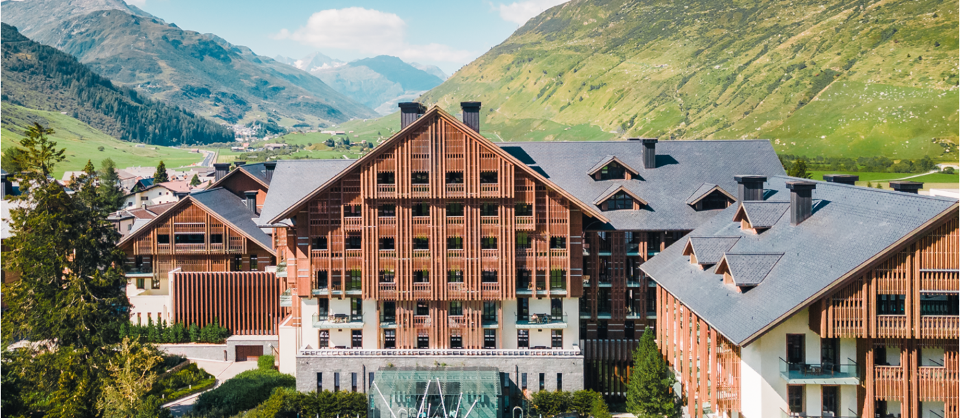Luxury Resort Chedi Andermatt in Switzerland Exterior View of Entrance with Mountain Background