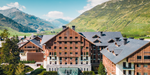 Luxury Resort Chedi Andermatt in Switzerland Exterior View of Entrance with Mountain Background