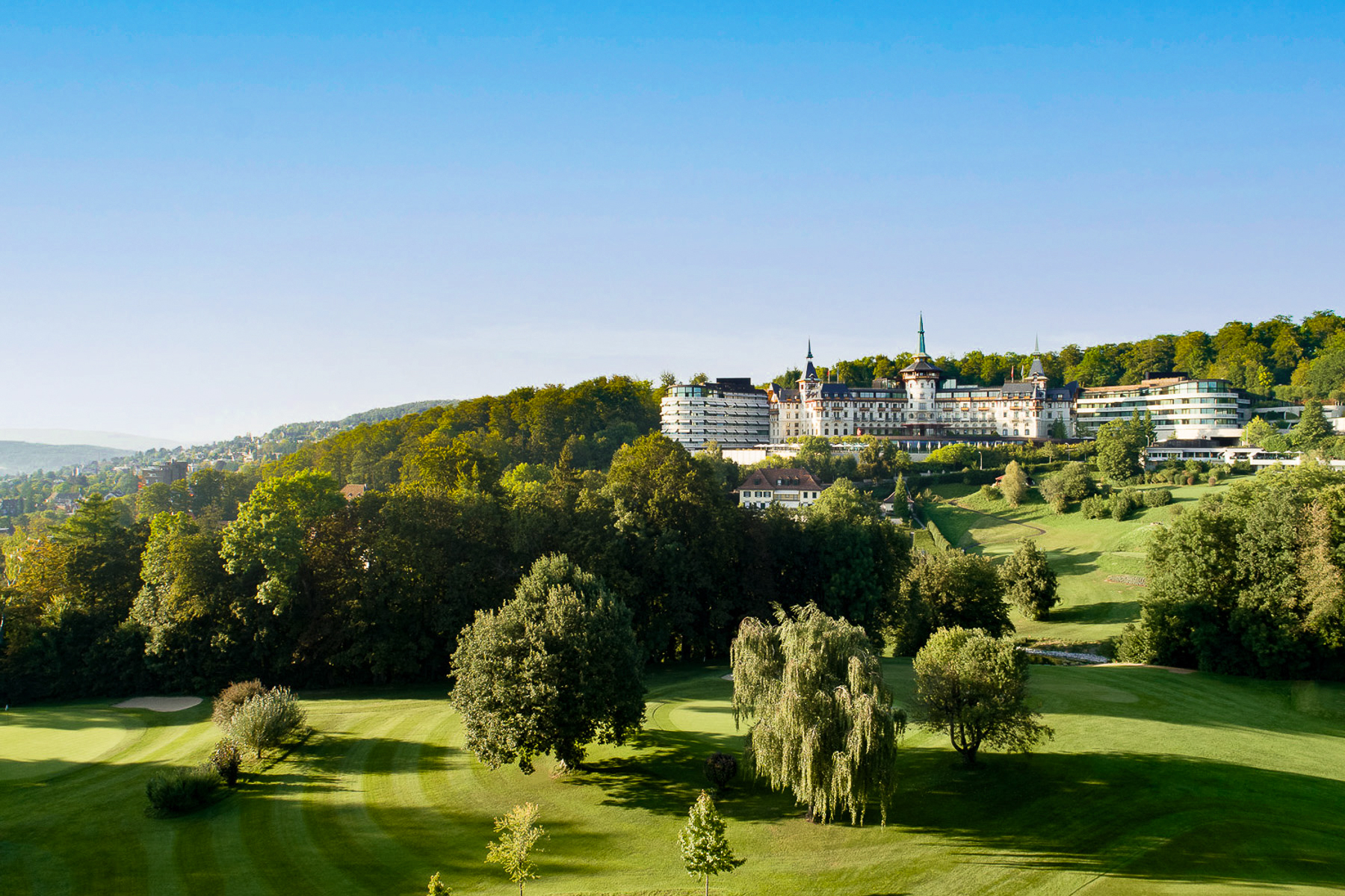 Exterior view of the Dolder Grand luxury hotel and golf course in Zurich