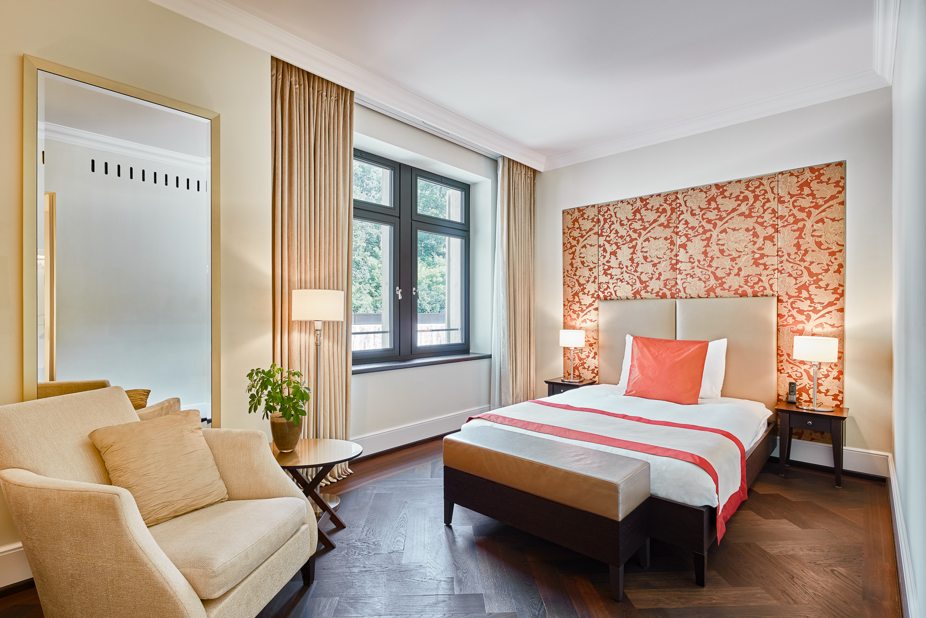 Orange suite bedroom at the Dolder Grand luxury hotel in Zurich