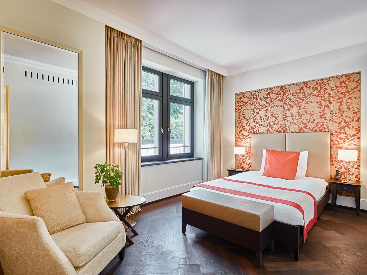 Orange suite bedroom at the Dolder Grand luxury hotel in Zurich