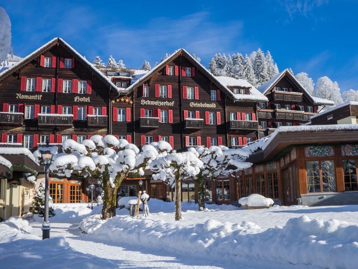 Exterior view of Hotel Schweizerhof in Zermatt during winter