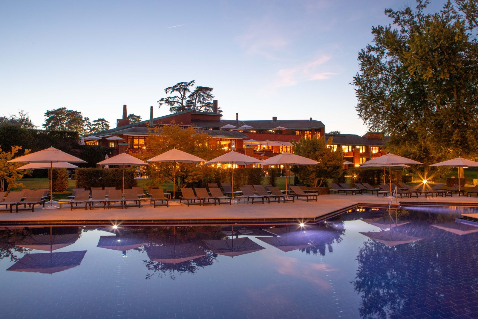 Swimming pool and terrace at La Reserve Geneva Switzerland