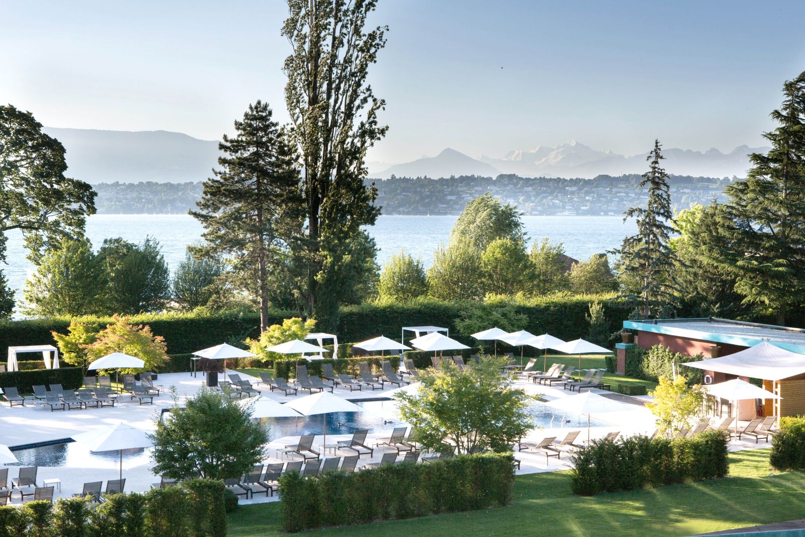 Swimming pool and lake views at La Reserve Geneva Switzerland