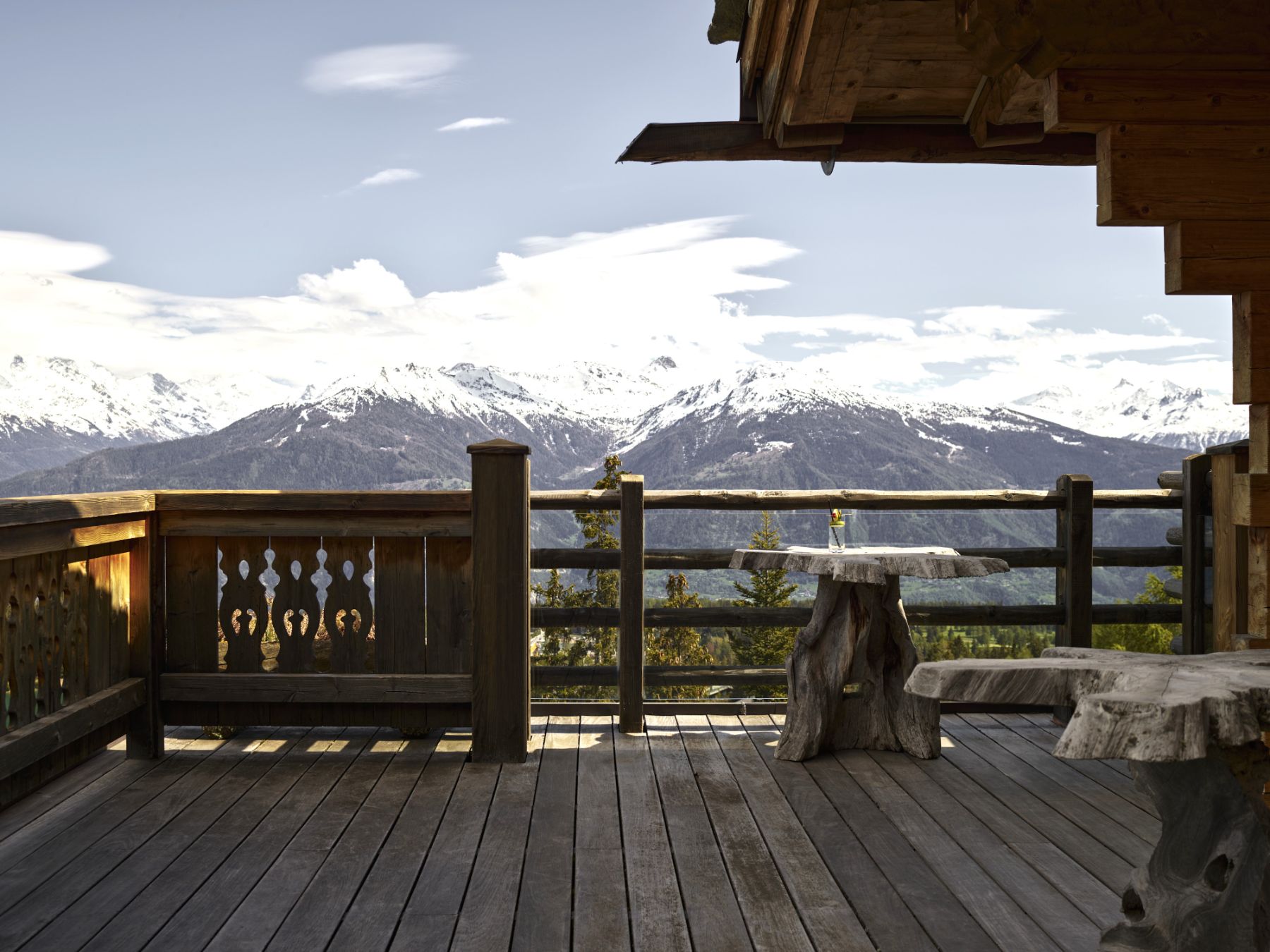 Terrace with mountain views at Le Crans in Switzerland