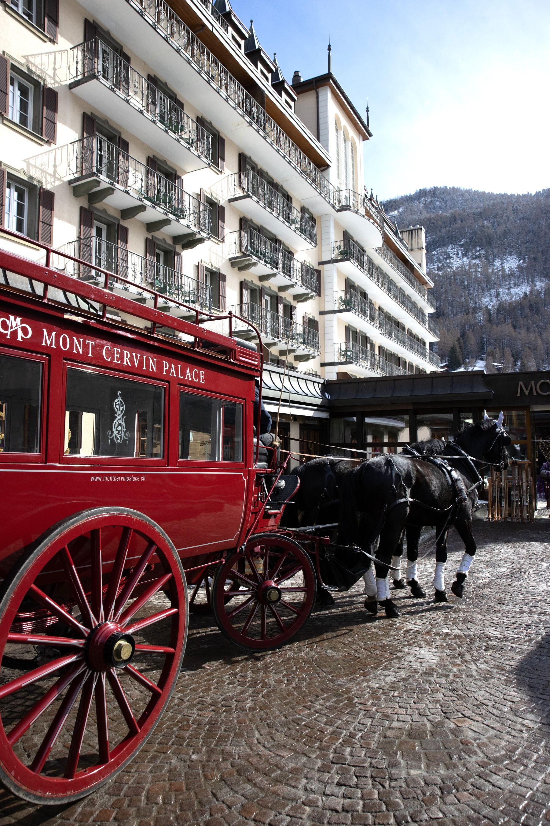 Horse-drawn carriage at Mont Cervin Palace in Zermatt