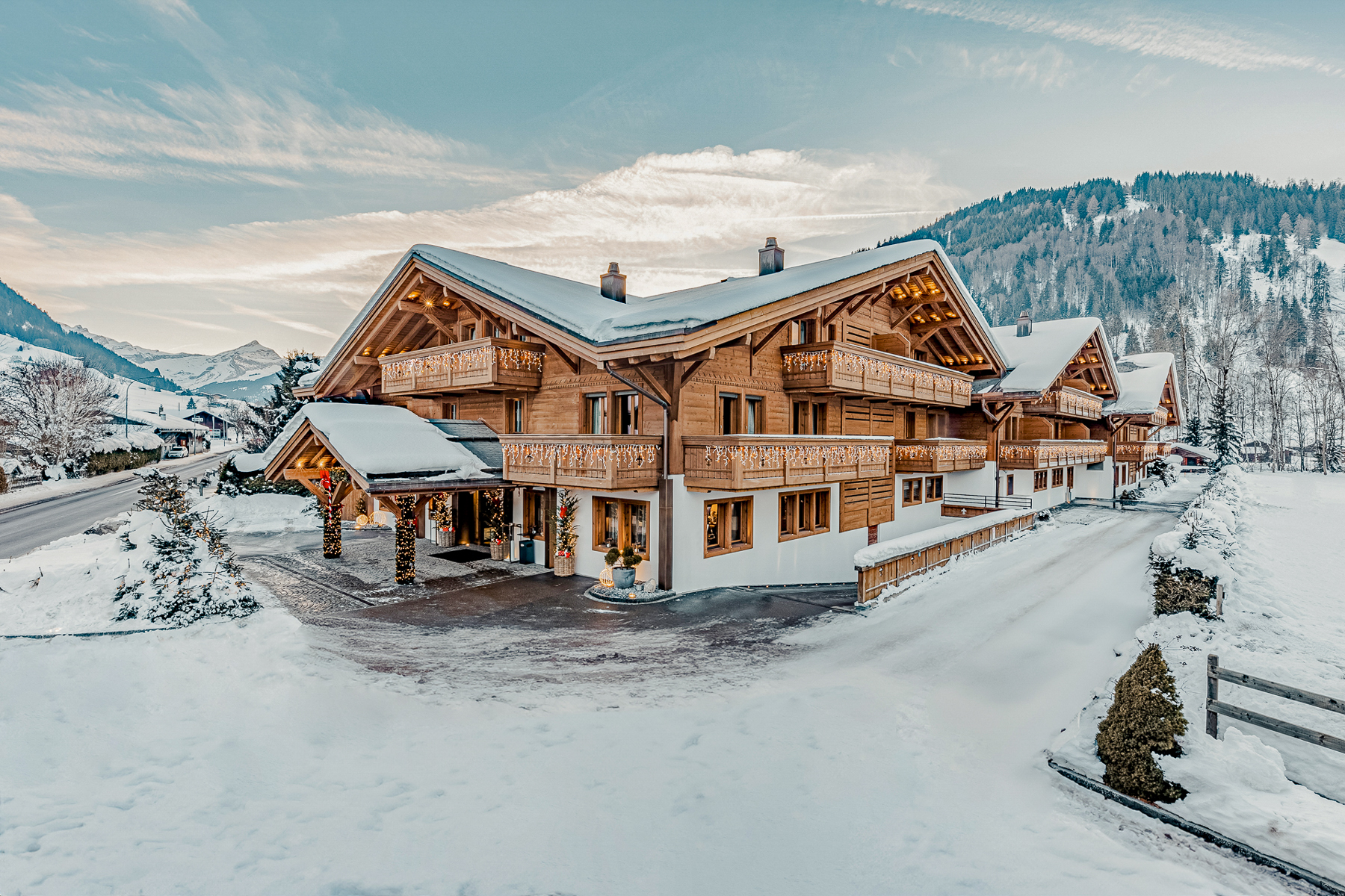 Exterior view of Ultima Hotel Gstaad in Switzerland during winter