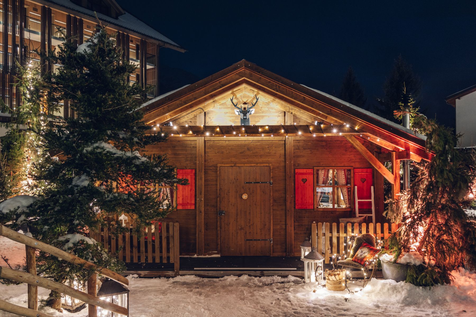 Exterior view of a winter village chalet at Chedi Andermatt in Switzerland