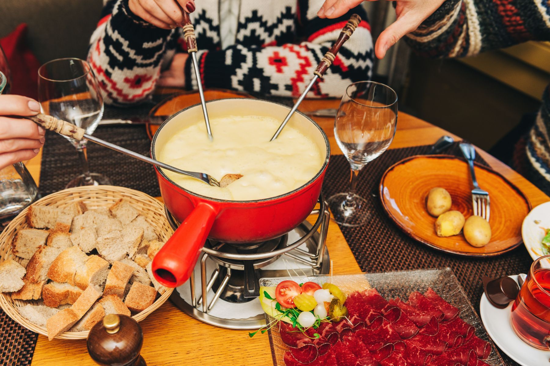 People tucking into a Swiss raclette