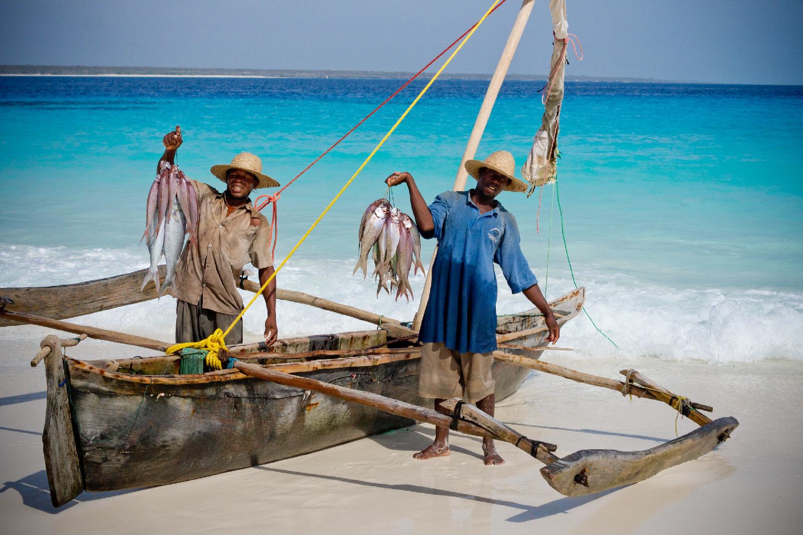 Fishermen with fresh caught fish near andBeyond Mnemba Island Lodge, Zanzibar