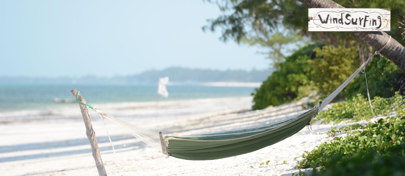 A hammock on the beach at Breezes Beach Club