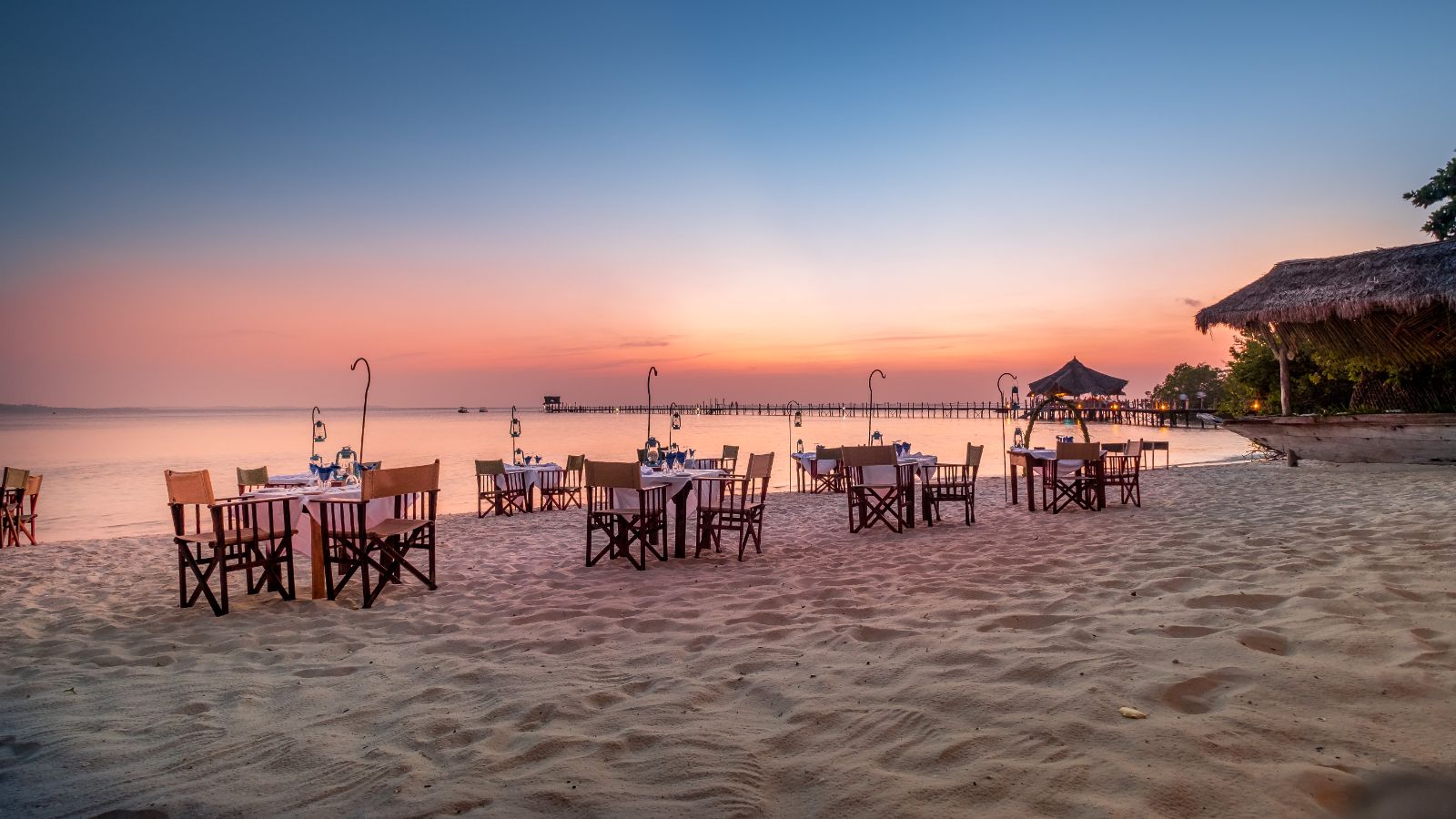 Sunset dining on the beach at luxury hotel Fundu Lagoon on Zanzibar