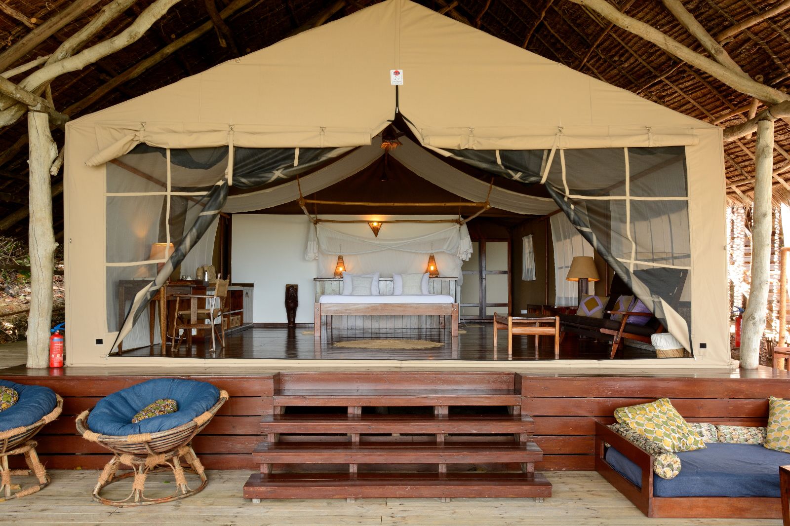 View of the interior of a Superior Suite bedroom at luxury hotel Fundu Lagoon on Zanzibar