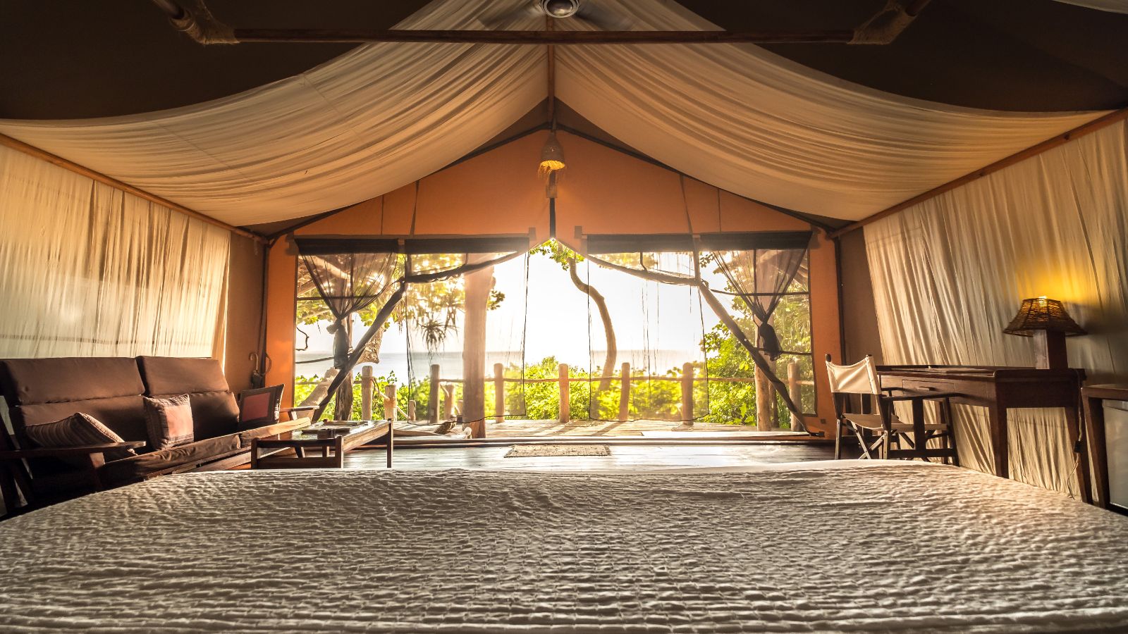 View from the bed of a Superior Suite at luxury hotel Fundu Lagoon on Zanzibar