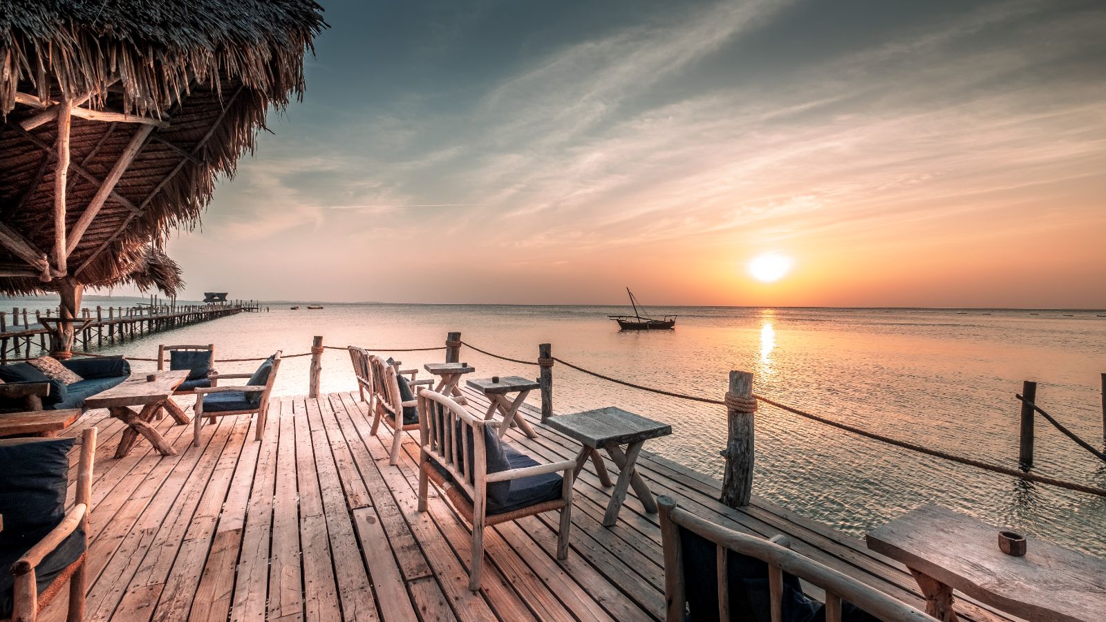 Seaside dining at sunset at luxury hotel Fundu Lagoon on Zanzibar