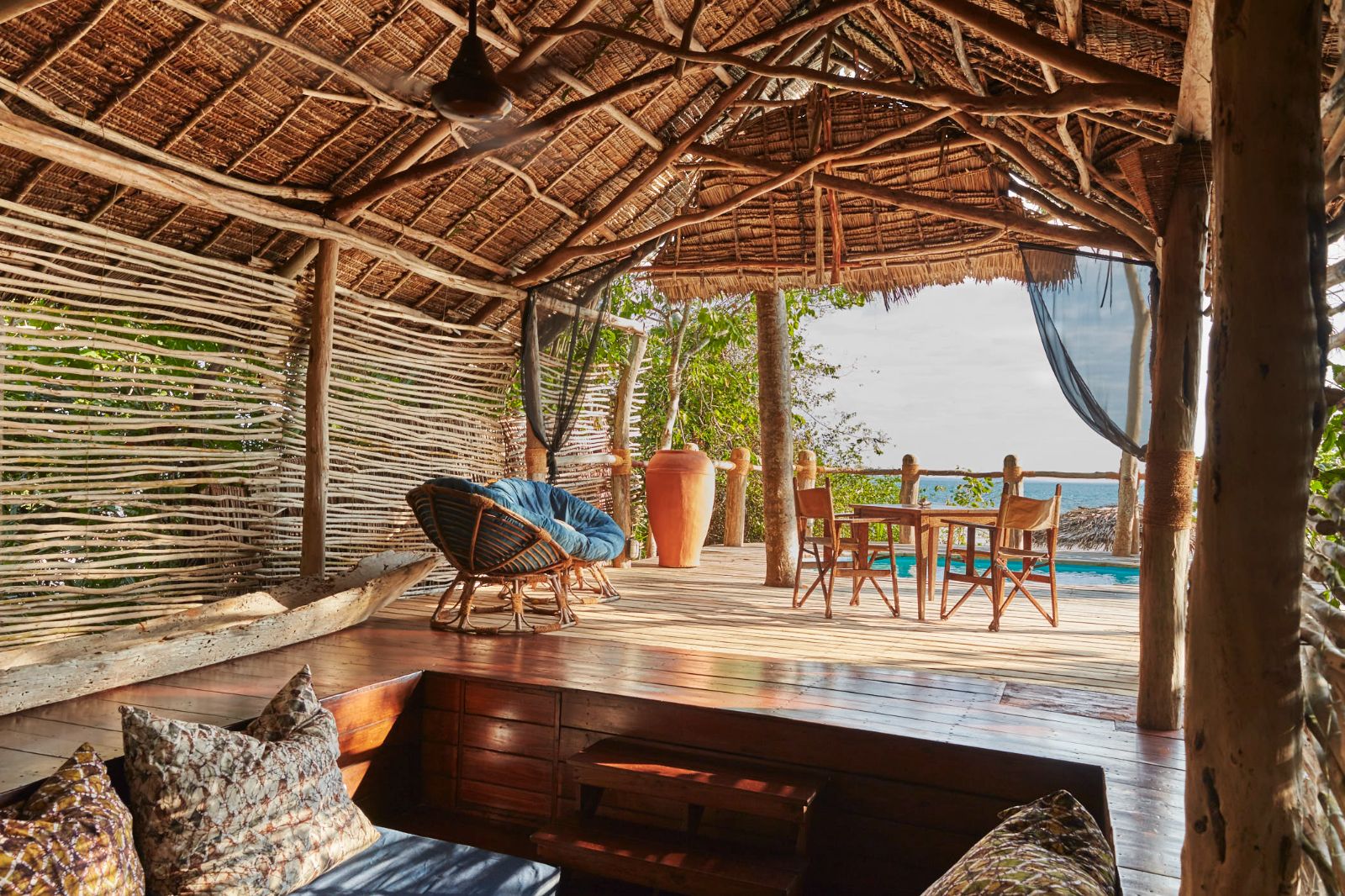 Outdoor lounge and dining area of a superior suite at luxury hotel Fundu Lagoon on Zanzibar