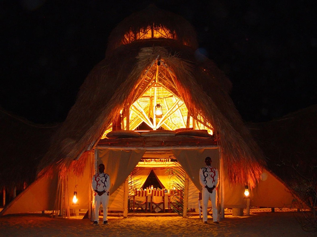 Entrance of dining area at night at Greystroke Mahale in Tanzania