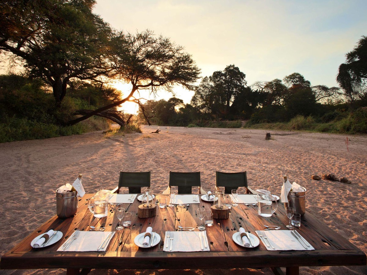 Sand river dining at Jongomero in Tanzania