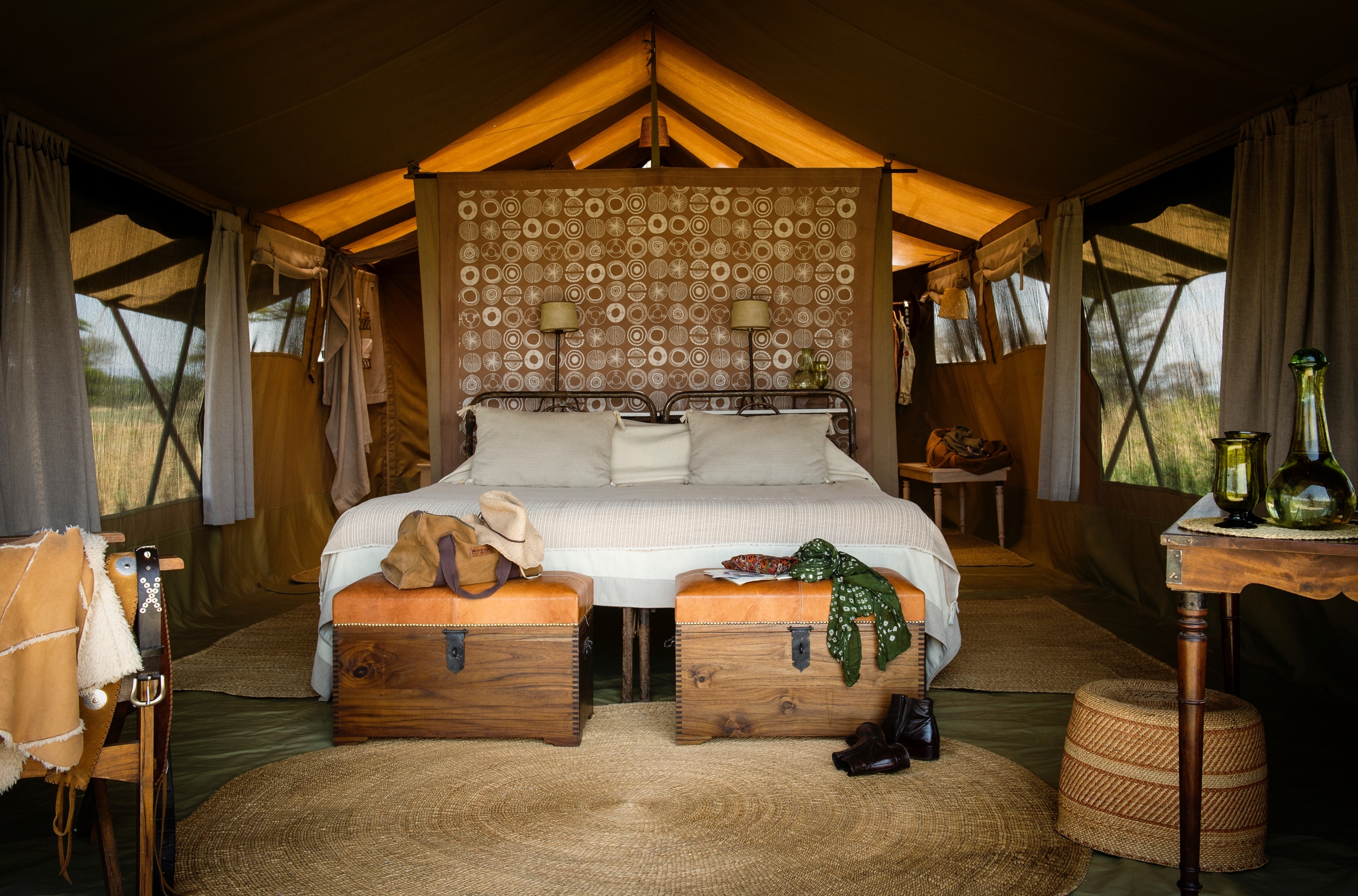 bedroom with double bed at the Serengeti safari camp in tanzania