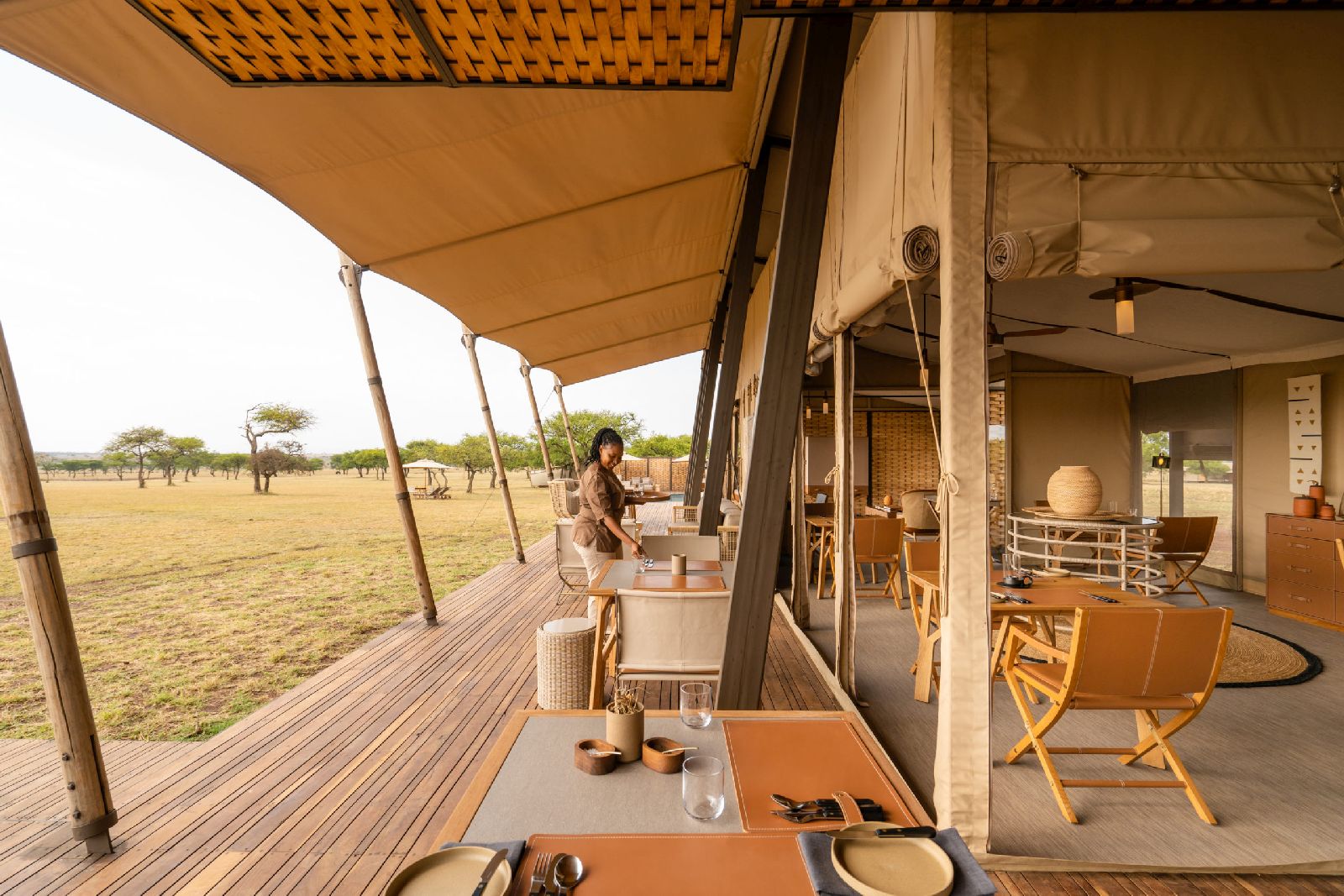 Outdoor dining terrace at Singita Sabora Tented Camp in Tanzania
