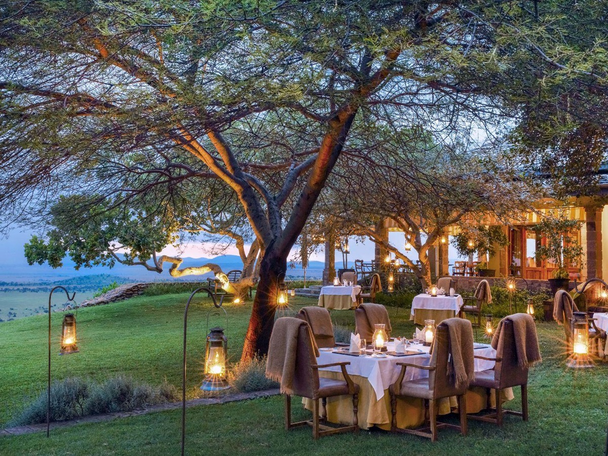 Outdoor candlelit dining at Singita Sasakwa Lodge in Tanzania