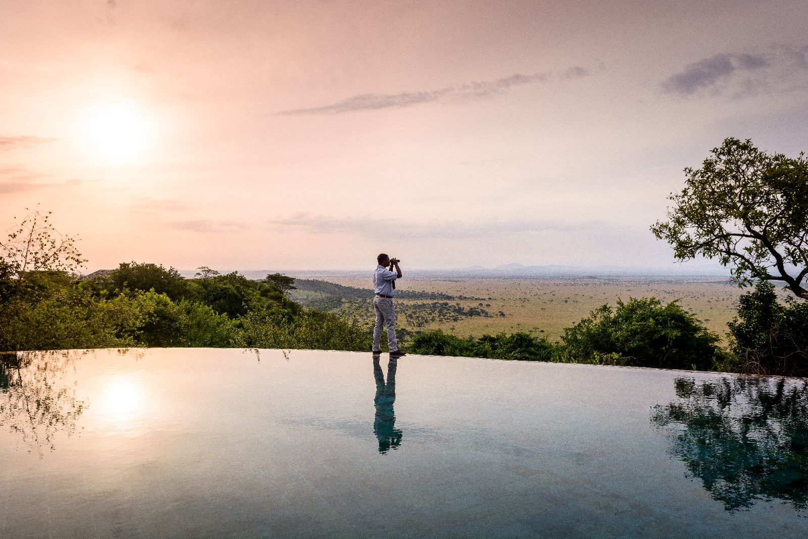 Sunset views from the swimming pool at Singita Sasakwa Lodge in Tanzania