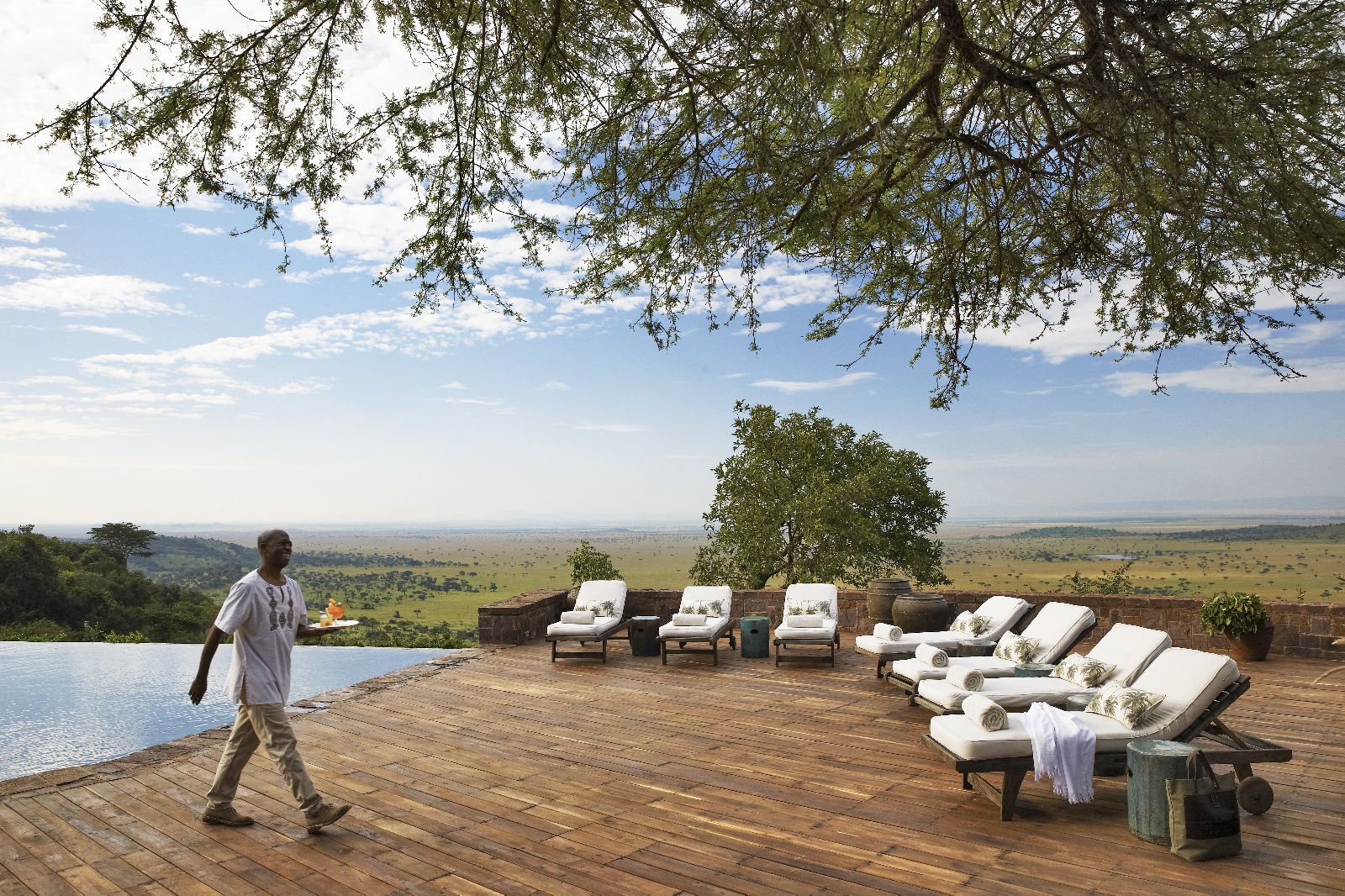 The swimming pool and terrace at Singita Sasakwa Lodge in Tanzania