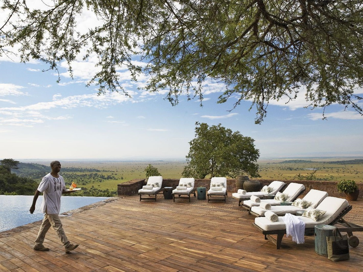 The swimming pool and terrace at Singita Sasakwa Lodge in Tanzania