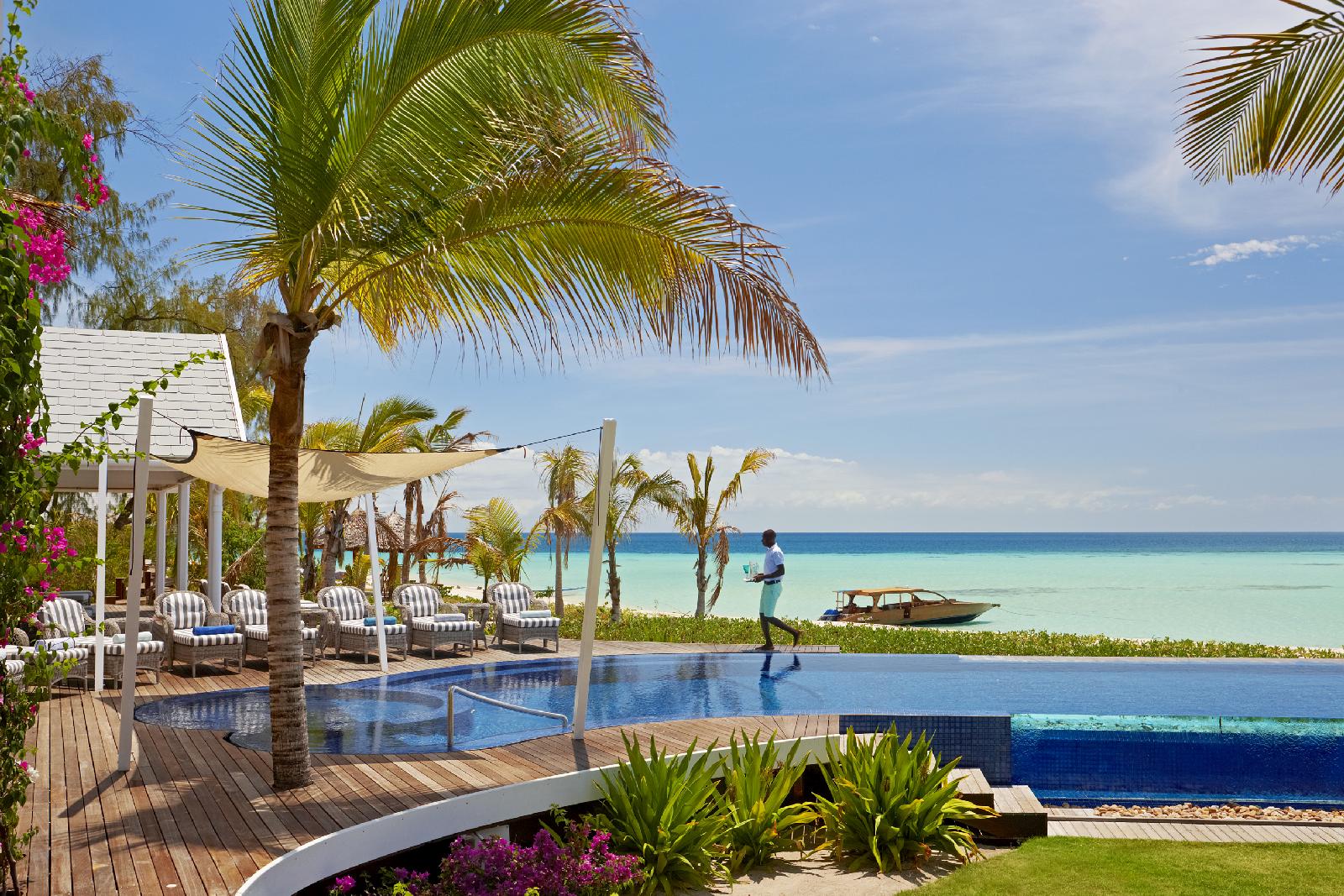 The swimming pool with sun loungers of Thanda Island, Zanzibar