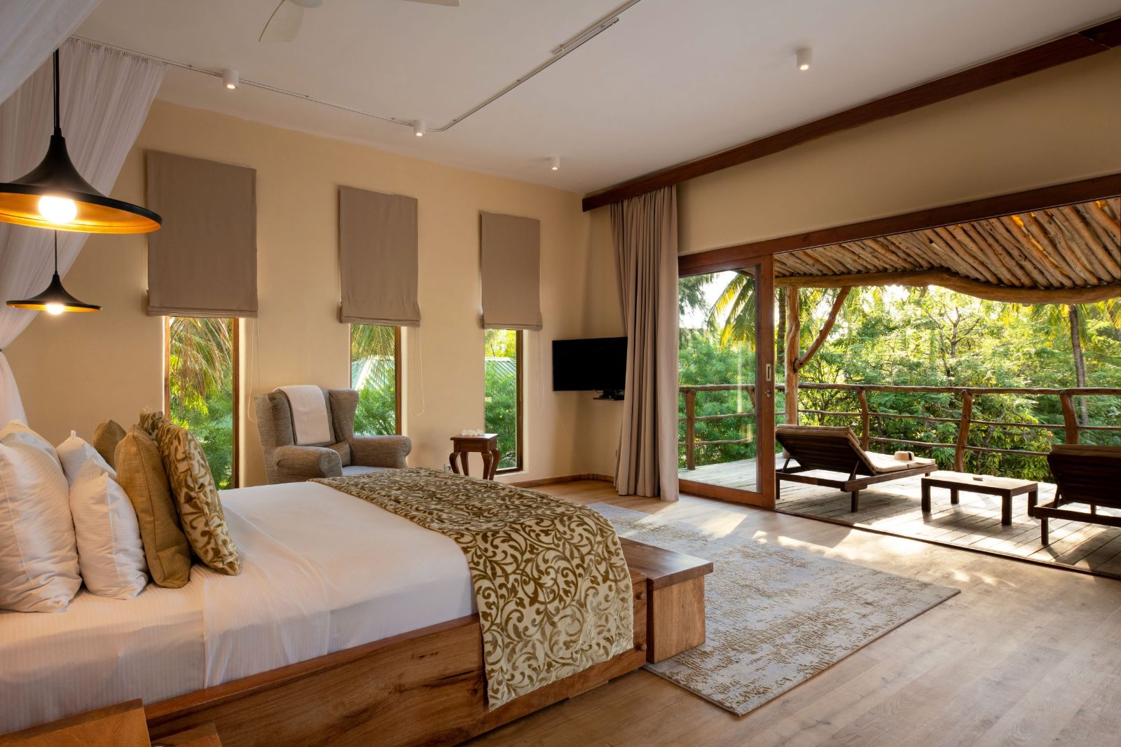 Double bed and terrace at White Sands resort in Zanzibar