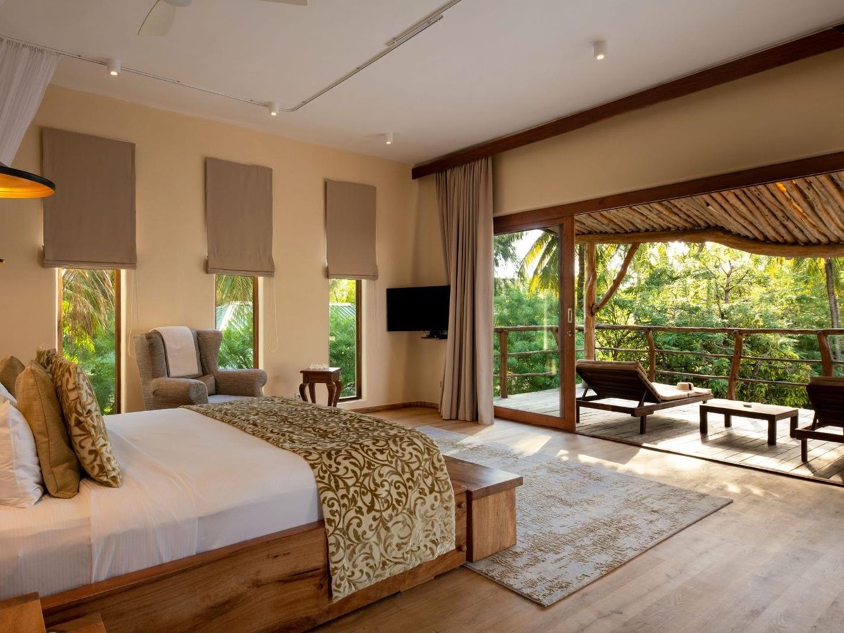 Double bed and terrace at White Sands resort in Zanzibar