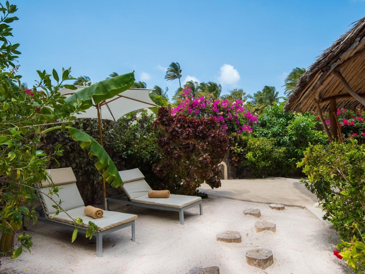 Villa tarrace area with sunbeds at White Sands resort in Zanzibar