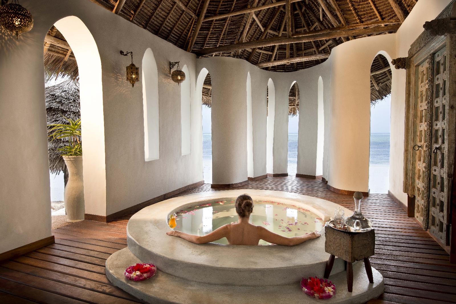 A woman bathing in the spa pool at Xanadu, Zanzibar