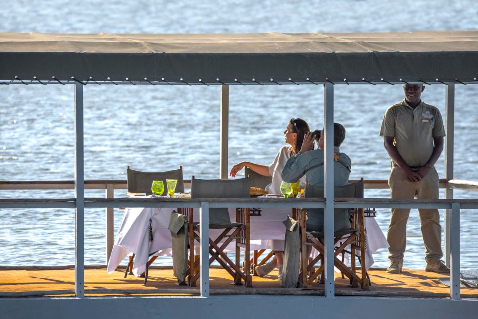 Sundowners on a boat at Siwandu in Tanzania